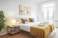 A bed or beds in a room at Autonomia - The Rentals Collection