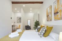 A bed or beds in a room at Autonomia - The Rentals Collection