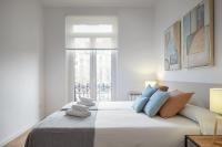 A bed or beds in a room at Autonomia - The Rentals Collection