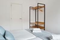 A bed or beds in a room at Autonomia - The Rentals Collection
