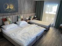 Łóżko lub łóżka w pokoju w obiekcie Hotel HAAS