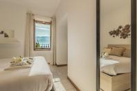 A bed or beds in a room at Casa Magnolia Varenna