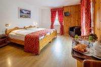 Posteľ alebo postele v izbe v ubytovaní Hotel Aquila
