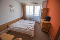Postel nebo postele na pokoji v ubytování Hotel Sport