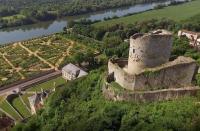 an old castle on a hill next to a river at Appt cosy coeur historique+park, 5mn gare Vernon in Vernon