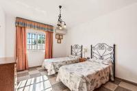 Postel nebo postele na pokoji v ubytování Villa Maria Isabel