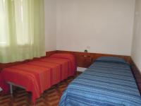 A bed or beds in a room at Wonderful Villa in a quiet place in Bibione