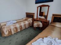 Postel nebo postele na pokoji v ubytování Guest Rooms Grachenovi