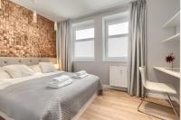Łóżko lub łóżka w pokoju w obiekcie Apartamenty MUNN 6 Szczecin