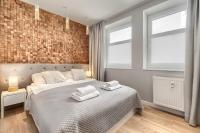 Łóżko lub łóżka w pokoju w obiekcie Apartamenty MUNN 6 Szczecin