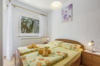 Łóżko lub łóżka w pokoju w obiekcie Apartments Lovely Katarina