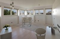 a white room with chairs and a table and windows at Le Méridien Vienna in Vienna