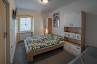 Postel nebo postele na pokoji v ubytování Apartmá u Baštů