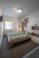 Postel nebo postele na pokoji v ubytování Apartmá u Baštů