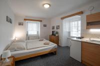 Postel nebo postele na pokoji v ubytování Apartmá u Baštů