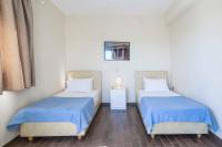 A bed or beds in a room at Villa Rigani