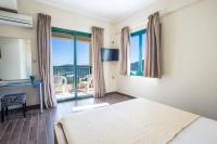 A bed or beds in a room at Villa Rigani