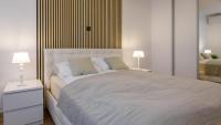 Posteľ alebo postele v izbe v ubytovaní President Apartment with Sauna