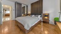 Posteľ alebo postele v izbe v ubytovaní President Apartment with Sauna