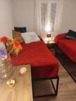 A bed or beds in a room at Mi Casa es tu Casa