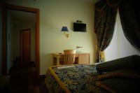 Łóżko lub łóżka w pokoju w obiekcie HOTEL CONCORDE