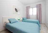 A bed or beds in a room at Harbour Lights