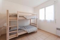 Łóżko lub łóżka w pokoju w obiekcie Le Mérou de Vacances Giens