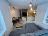 A seating area at LUX apartmany Romantika CHOPOK 7, 19