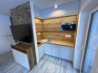 A kitchen or kitchenette at LUX apartmany Romantika CHOPOK 7, 19