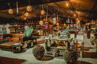 a room with chairs and tables in a store at Cerro Tusa Glamping in Titiribí