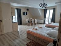 Łóżko lub łóżka w pokoju w obiekcie Apartamenty Na Rozstaju