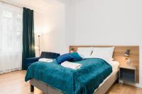 Łóżko lub łóżka w pokoju w obiekcie Kwiatowa Apartments Poznań City Center by Noclegi Renters