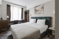 VICTORIA Hotel Klaipėdaにあるベッド