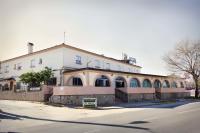 a building on the side of a street at Hotel Catalán Puerto Real in Puerto Real