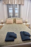 Posteľ alebo postele v izbe v ubytovaní Villa The Cosy Olive