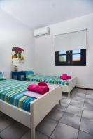 Posteľ alebo postele v izbe v ubytovaní Villa The Cosy Olive