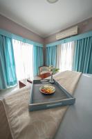 a room with a bed with a tray of food on it at Hotel Riviera in Mar del Plata