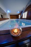 a candle in a bowl on a table next to a swimming pool at Hotel Riviera in Mar del Plata