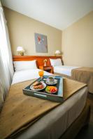 a tray of food on a table in a hotel room at Hotel Riviera in Mar del Plata