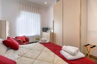 Posteľ alebo postele v izbe v ubytovaní La Preziosa Apartment