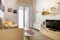 Televízia a/alebo spoločenská miestnosť v ubytovaní La Preziosa Apartment