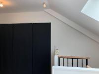 Łóżko lub łóżka w pokoju w obiekcie La maison d’à côté