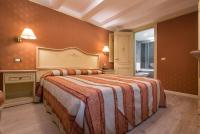 A bed or beds in a room at Hotel Conterie