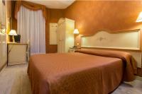 A bed or beds in a room at Hotel Conterie