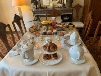 a table with a tea set with a turkey on it at Le Moulin du Carla in Lavaur