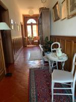 a hallway with a table and chairs in a room at Le Moulin du Carla in Lavaur