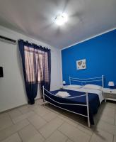 A bed or beds in a room at Terrazza del Santo 2,0 - La Terrazza nel cuore di Napoli
