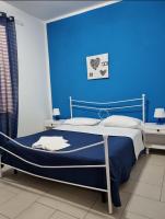 A bed or beds in a room at Terrazza del Santo 2,0 - La Terrazza nel cuore di Napoli