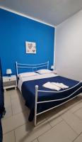 A bed or beds in a room at Terrazza del Santo 2,0 - La Terrazza nel cuore di Napoli