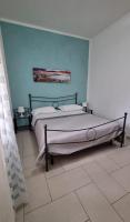 A bed or beds in a room at Terrazza del Santo 2,0 - La Terrazza nel cuore di Napoli